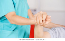 geriatric-nurse-holding-hands-senior-260nw-329394167